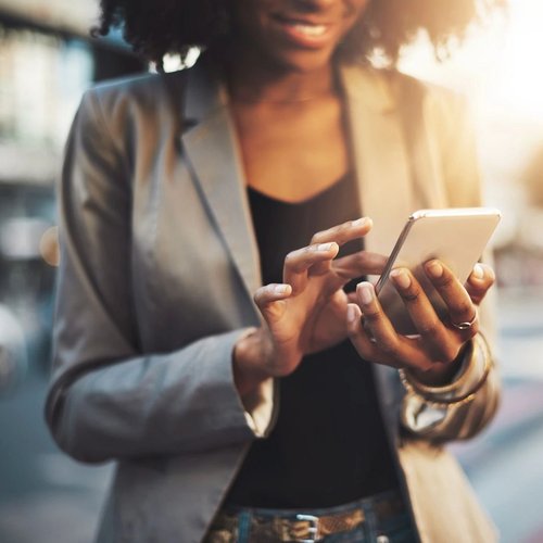 Woman On Her Phone Shopping For Flooring On Floors by Sterling Hight's Website | Hilton Head Island | 843-842-8886